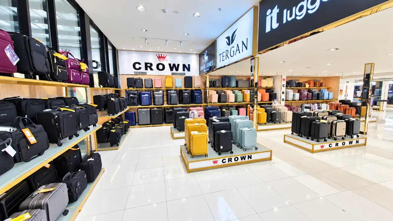 CROWN suitcase displays and surrounding travel bag shelves at SHONATI Sharjah