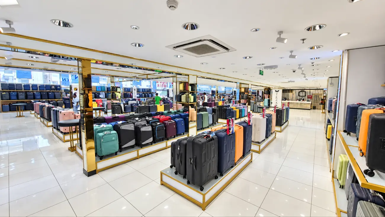 Rows of suitcases in different sizes and colours inside SHONATI Sharjah
