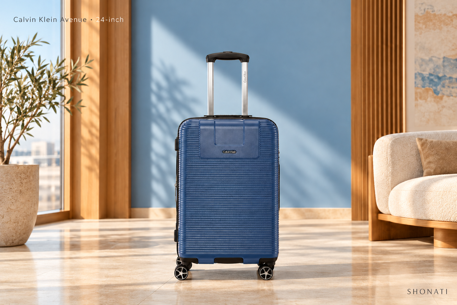 Calvin Klein Avenue · 24-inch Navy Calvin Klein Avenue suitcase in a sunlit blue and wood interior